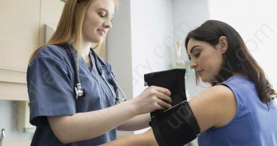 Doctor checking blood pressure