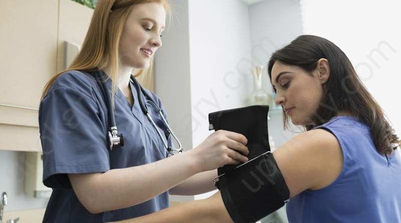 Doctor checking blood pressure