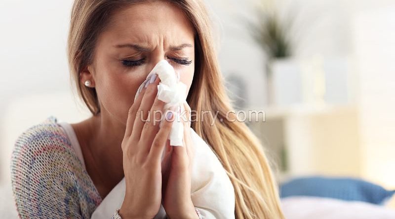 woman sneezing